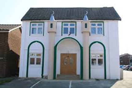 Gravesend Central Mosque — front view with green arches and minarets.